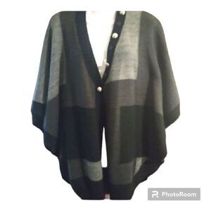 - Acrylic and wool blend batwing style sweater with accent buttons